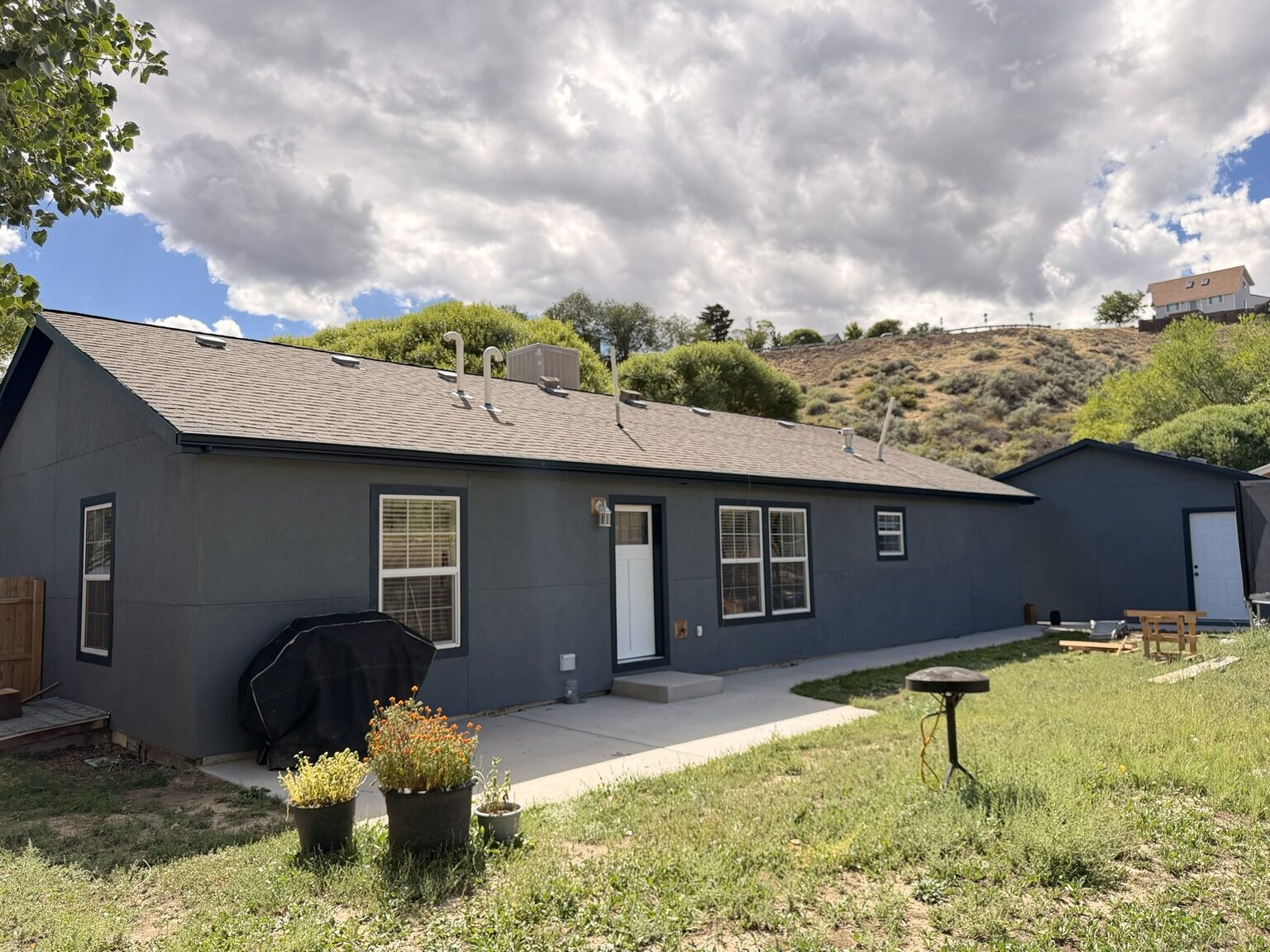 Finished gray stucco home exterior